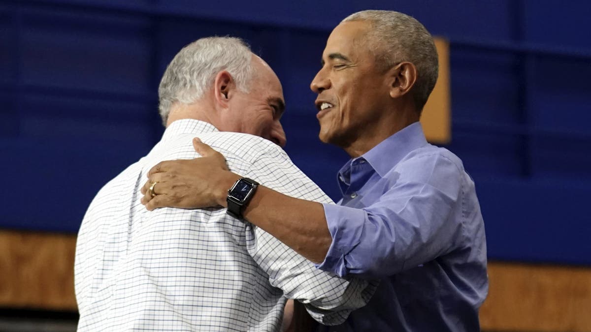 Former President Obama greets Sen. Bob Casey, D-Pa., before speaking at a campaign rally supporting Democrat presidential nominee Vice President Harris, Oct. 10, 2024, at the University of Pittsburgh's Fitzgerald Field House in Pittsburgh.