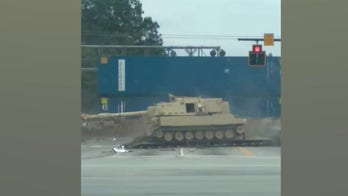 WATCH: Train smashes into mobile artillery vehicle